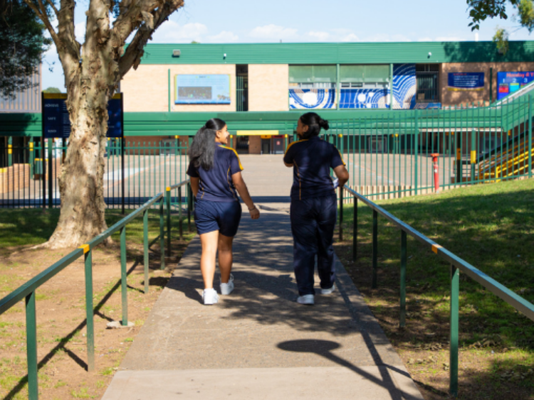 Two students walking into Chifley College Mount Druitt Campus