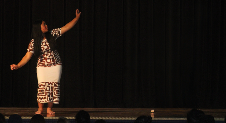 Female student performing cultural dance