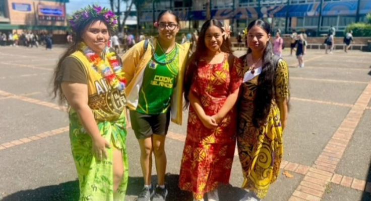 Four female students dressed in cultural dress.